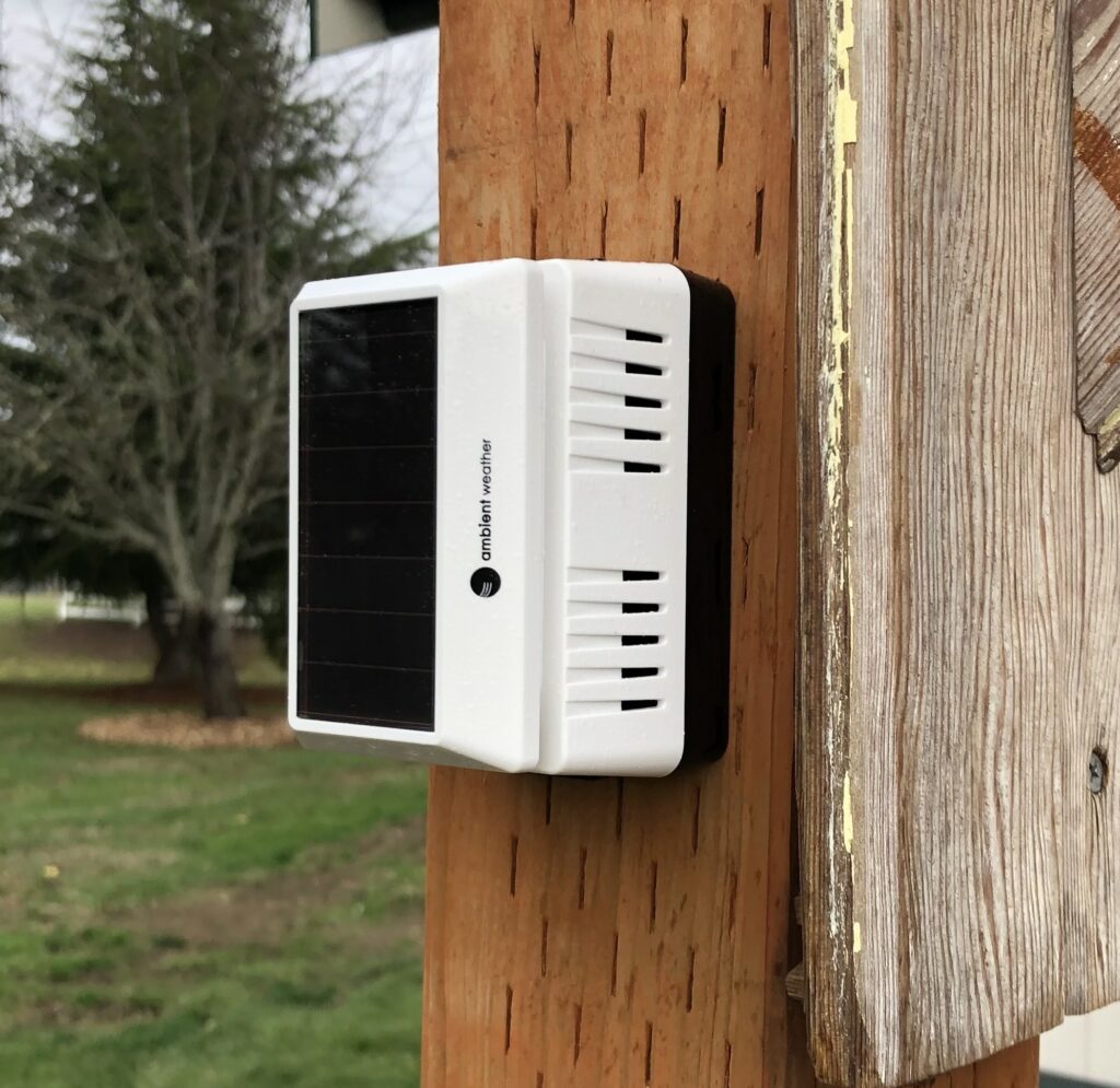 PM2.5 Air Monitoring device mounted on an outside post.